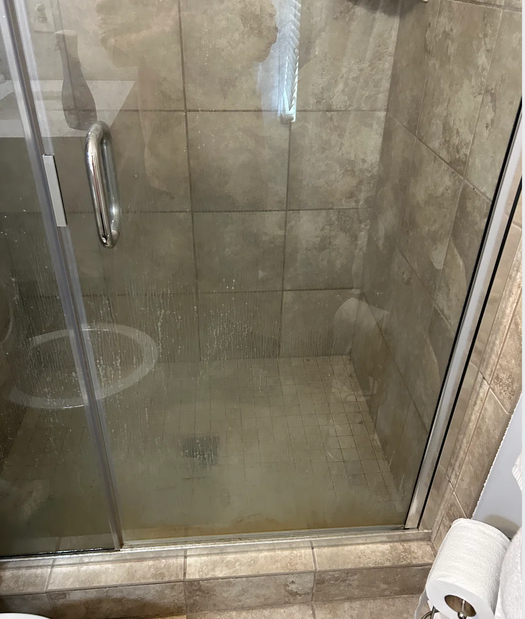 Glass shower before Kleaning360 detail cleaning
